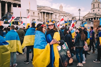 Volunteers distributing campaign materials in a bustling city square, engaging with citizens.