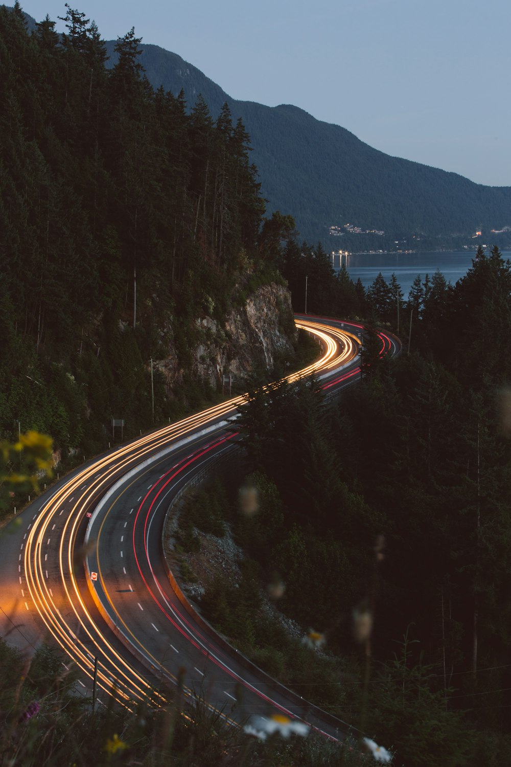 a long exposure shot of a highway at night