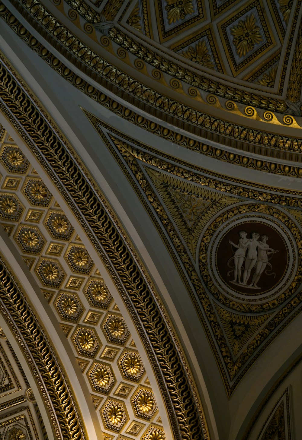 the ceiling of a building with a clock on it