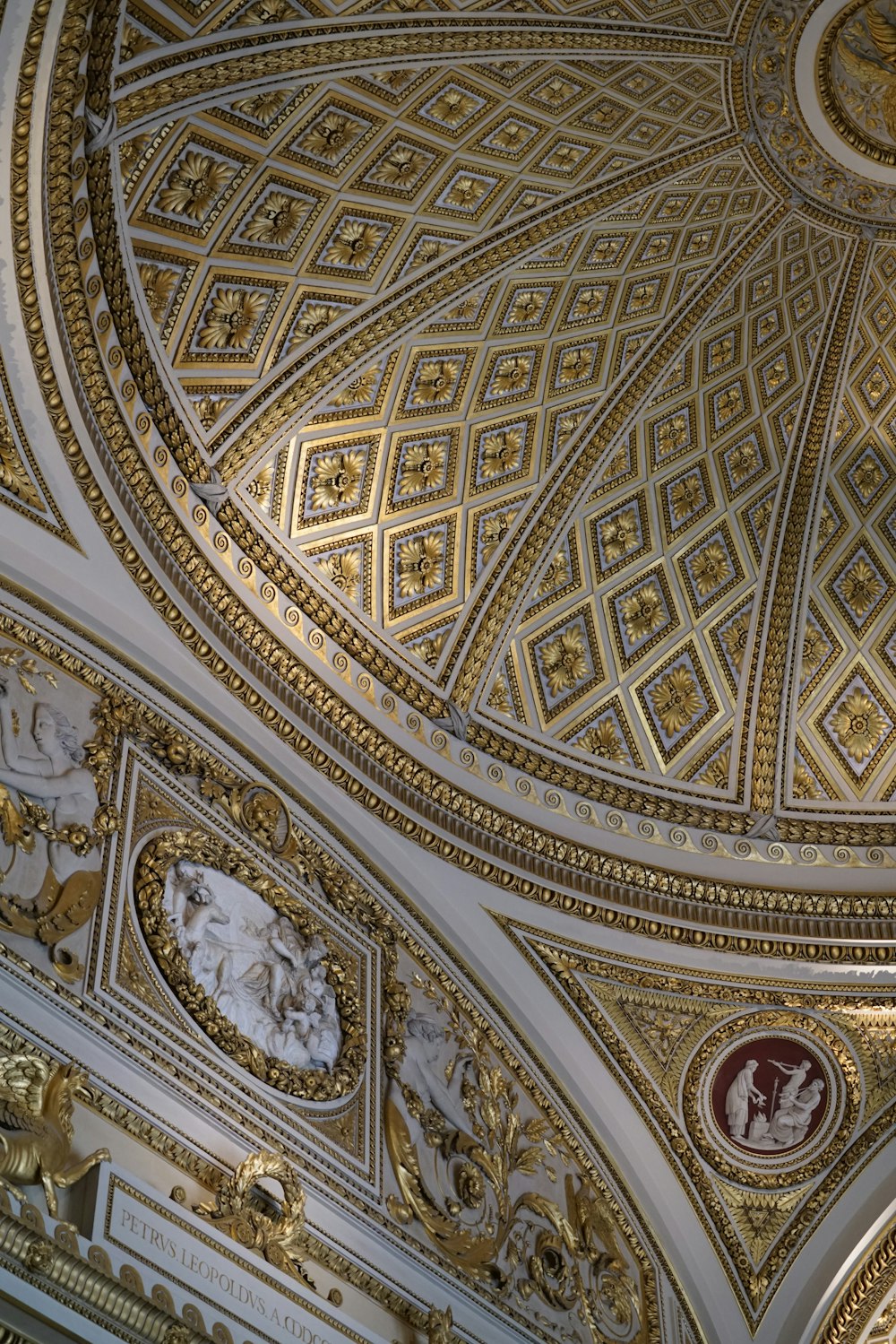 a ceiling in a building with a clock on it