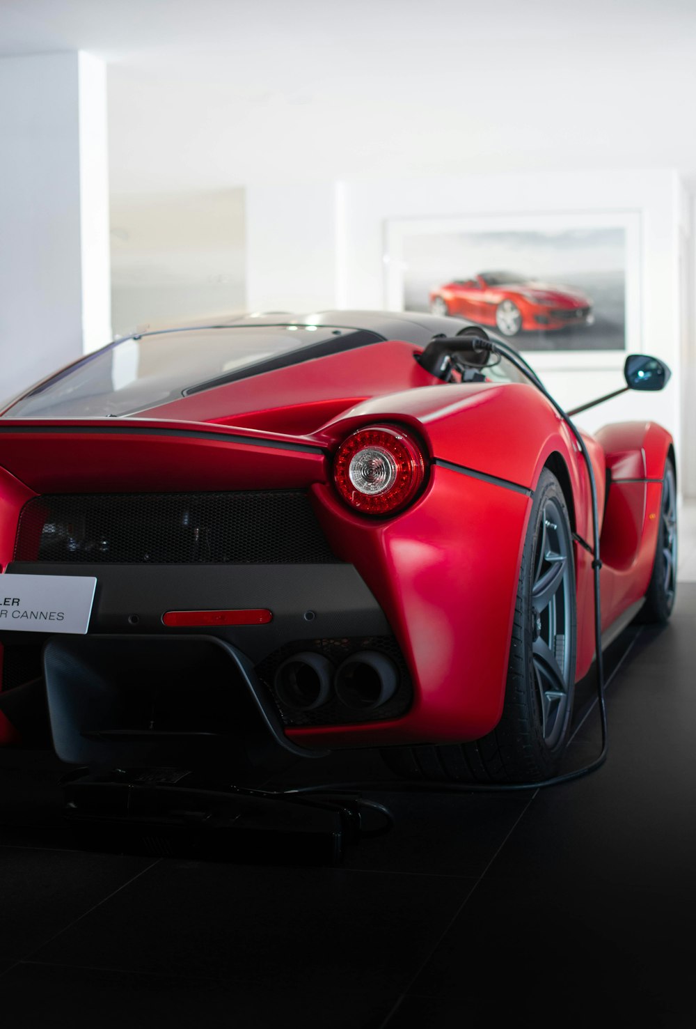 a red sports car parked in a garage