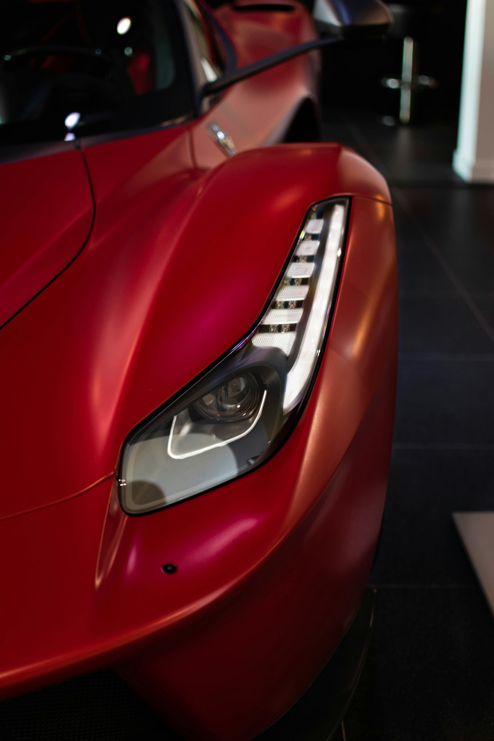 a close up of a red sports car