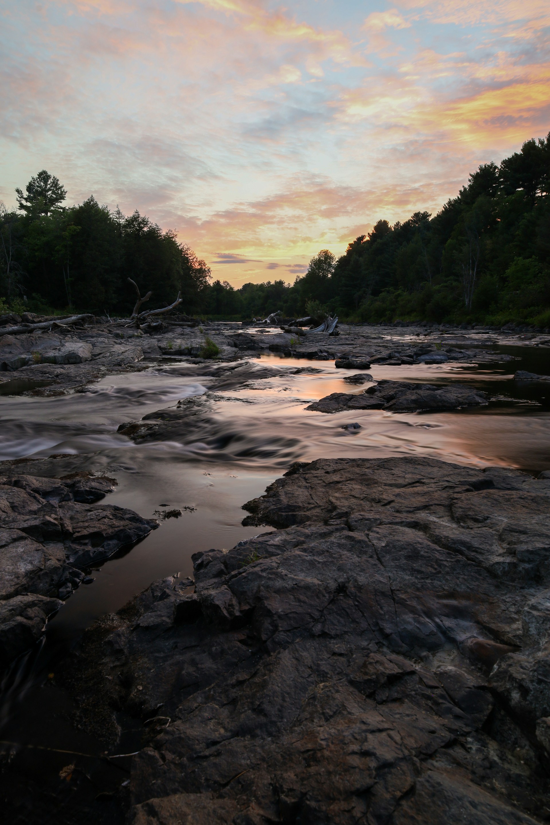 woman wearing yellow long-sleeved dress under white clouds and blue sky during daytime