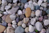 a heart shaped rock sitting on top of a pile of rocks