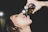 a woman is drinking from a bottle of wine