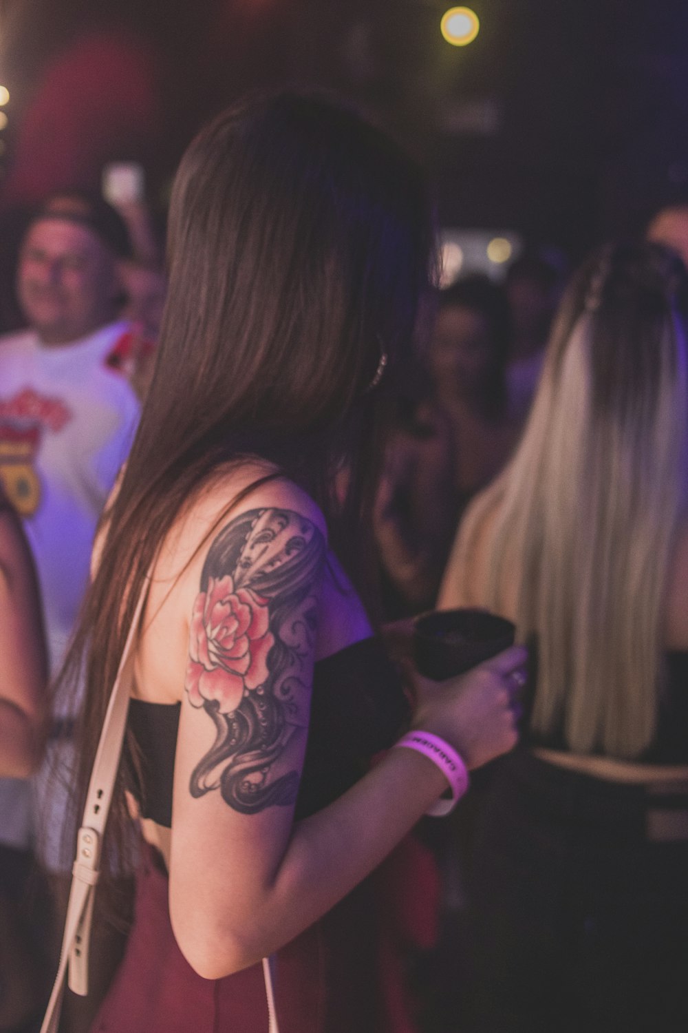 a woman with a tattoo on her arm