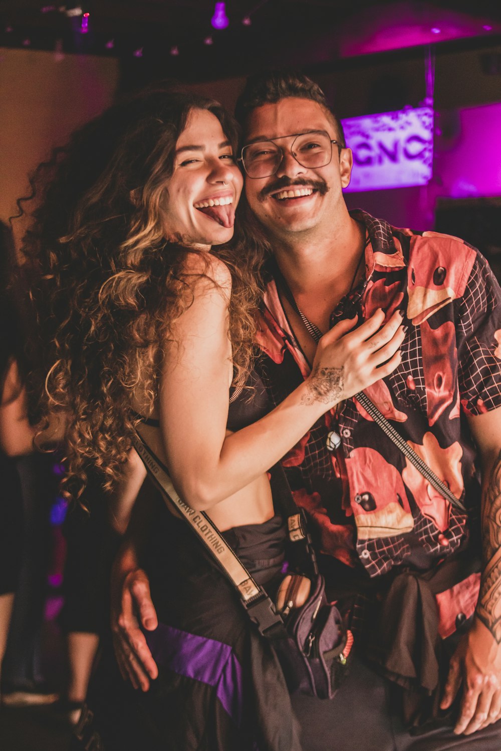 a man and a woman dancing together at a party