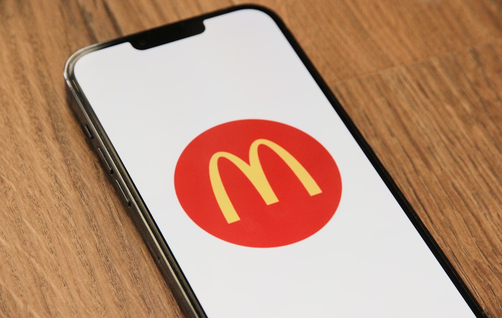 a cell phone with a mcdonald's logo on it