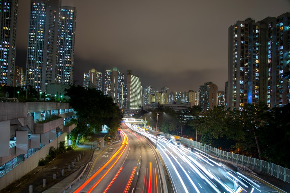 a city street filled with lots of traffic at night