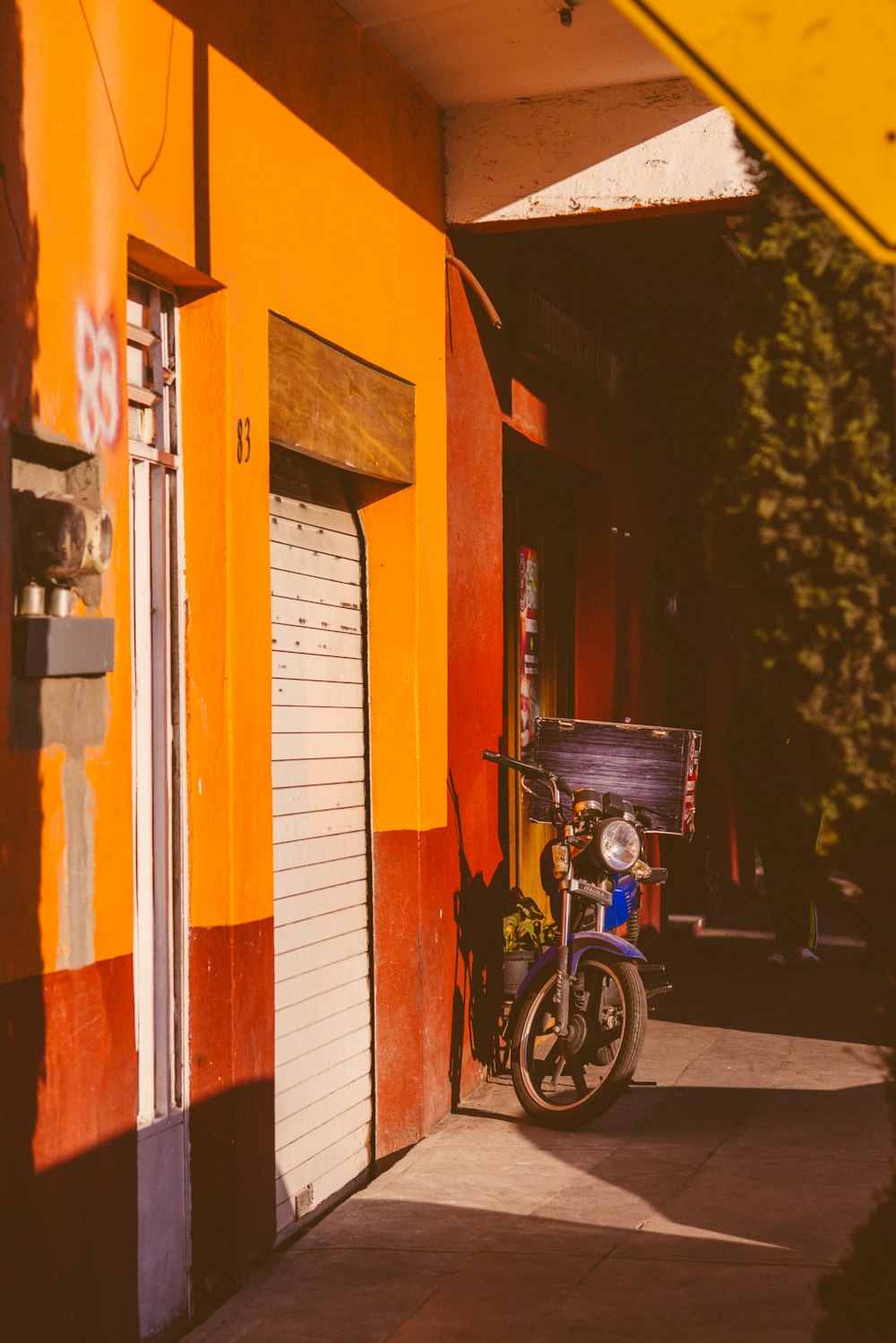 a motorcycle parked on the side of a building