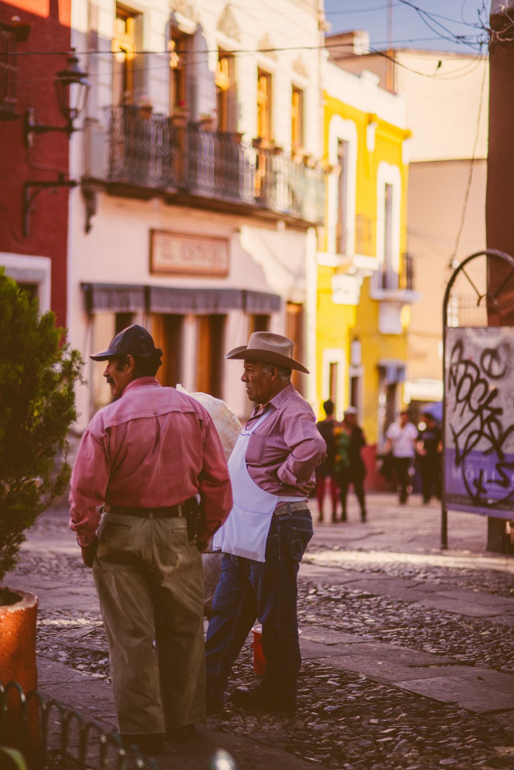 a couple of people that are standing in the street