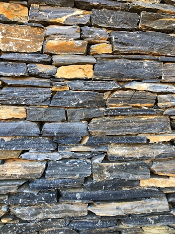 Close-up of stacked stone pieces highlighting their rough, natural edges.