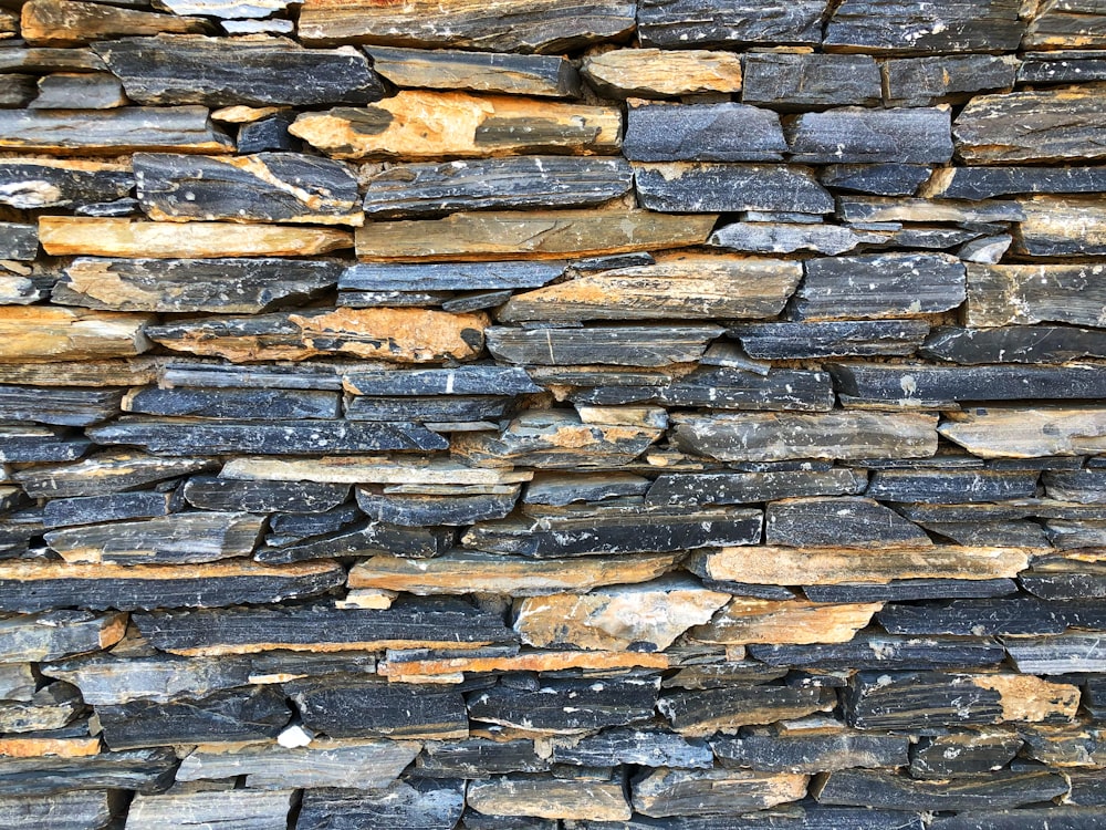 a close up of a stone wall made of rocks