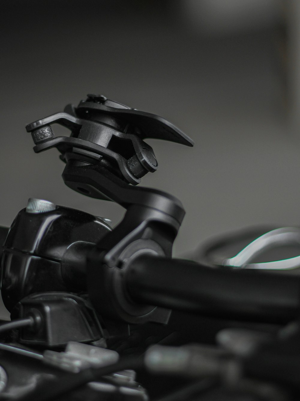 a close up of a motorcycle handlebar with a helmet on top of it