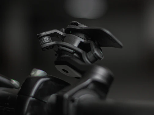 Detailed shot of a 3D printed hinge mechanism designed for Tentbox roof tents.