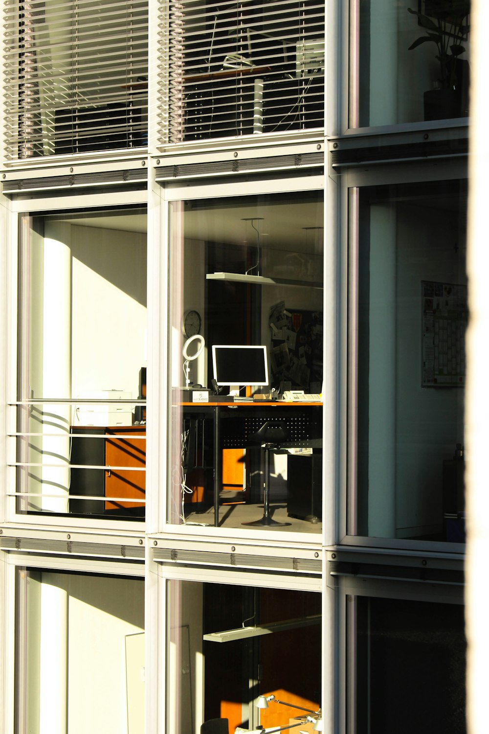 a view of a room through a window of a building