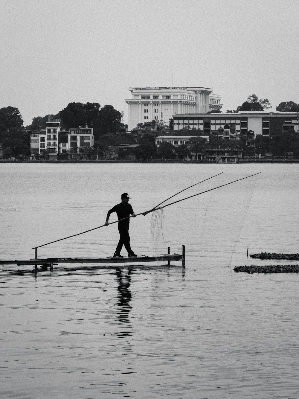 a man walking across a body of water