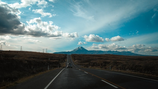 An open road stretching into the horizon, representing a journey.