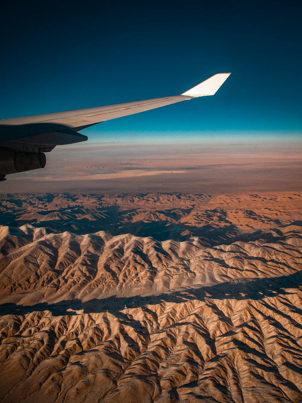 a view of a mountain range from an airplane