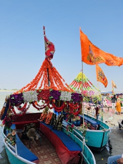 A beautifully decorated luxury boat floating on the Ganges at sunset.