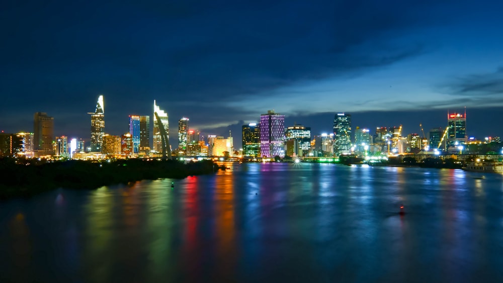 a view of a city at night from across the river