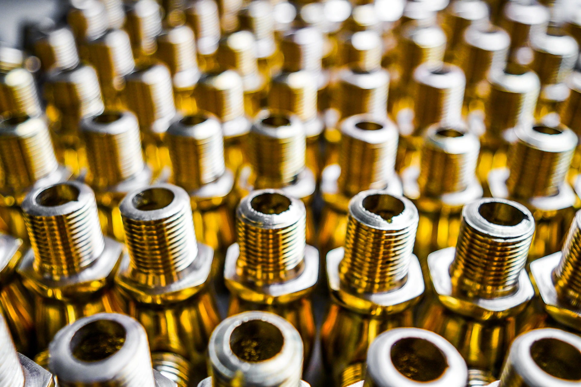 a close up of many screws and nuts