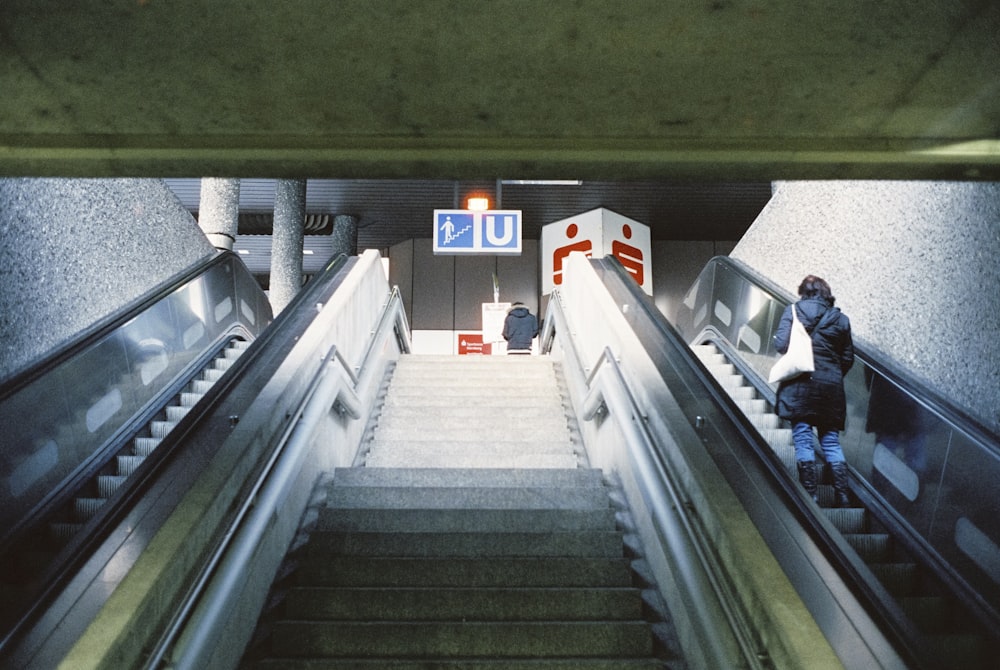 two people walking up a flight of stairs