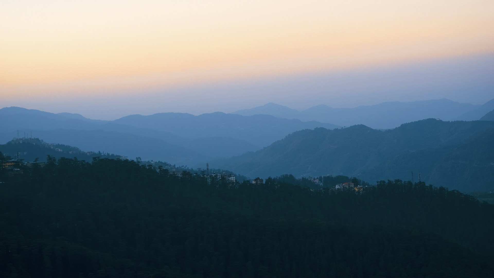 a view of a mountain range at sunset