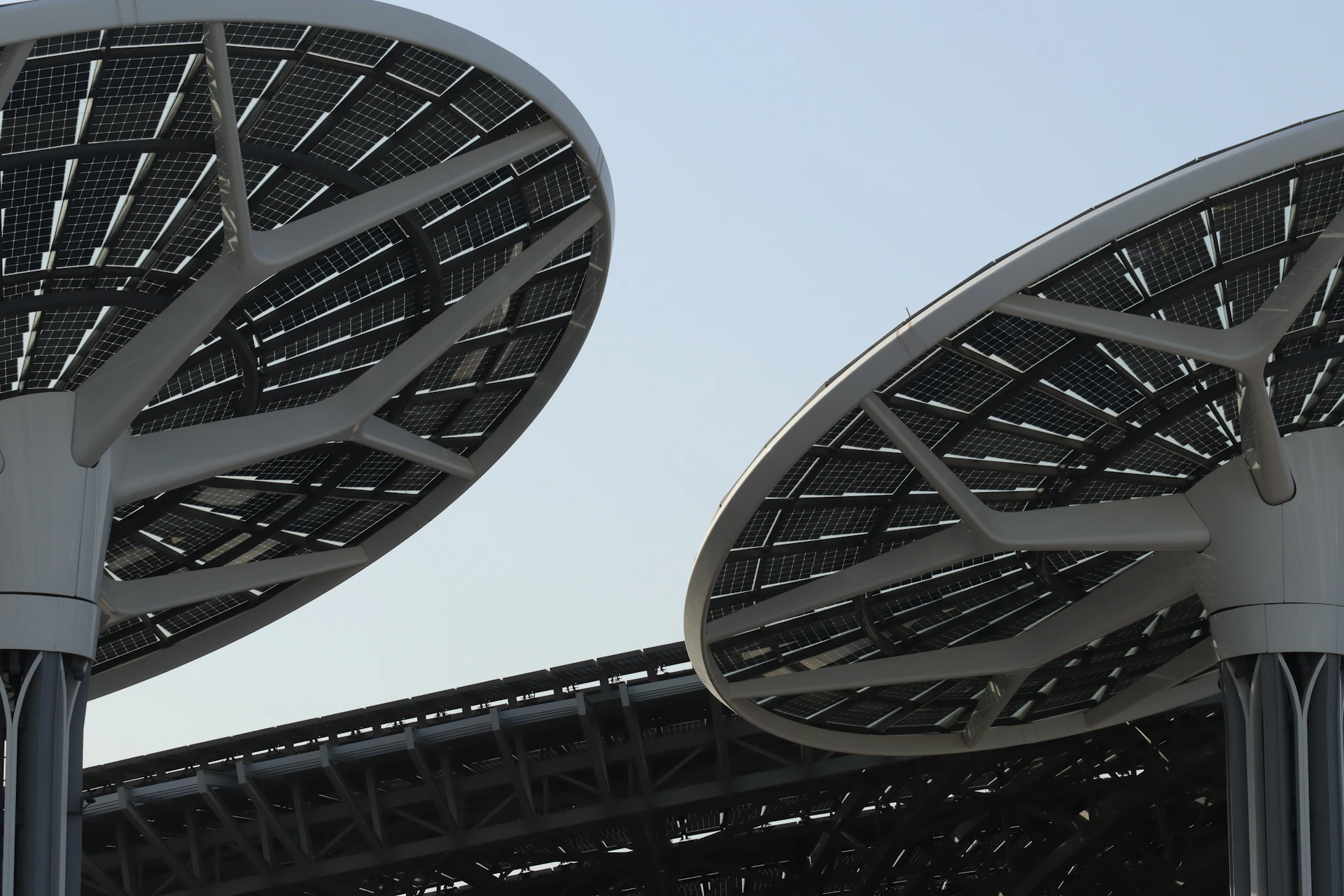 a close up of two metal poles with a sky in the background