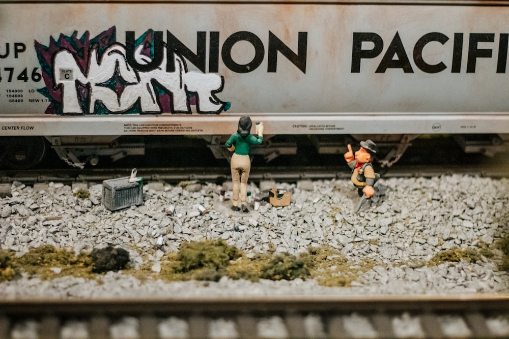 a couple of figurines that are on a train
