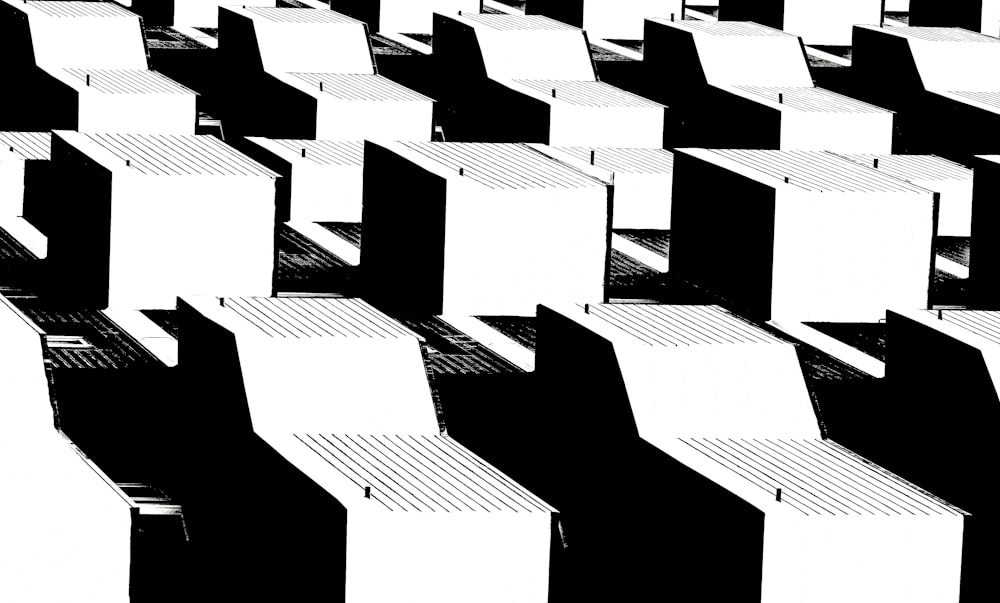 a black and white photo of rows of chairs