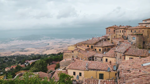 a view of a village from the top of a hill