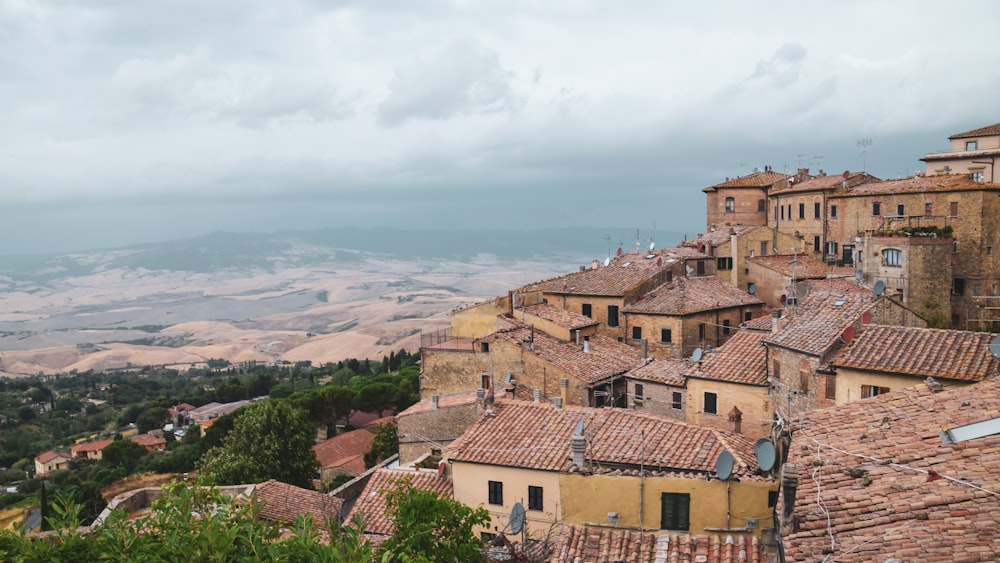 a view of a village from the top of a hill