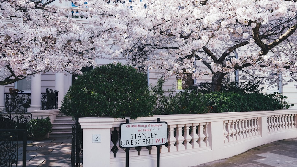 a white fence with a sign that says stanley crescent