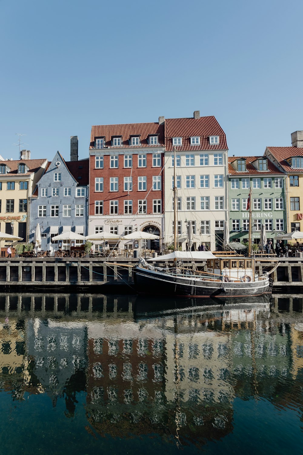 a row of buildings next to a body of water