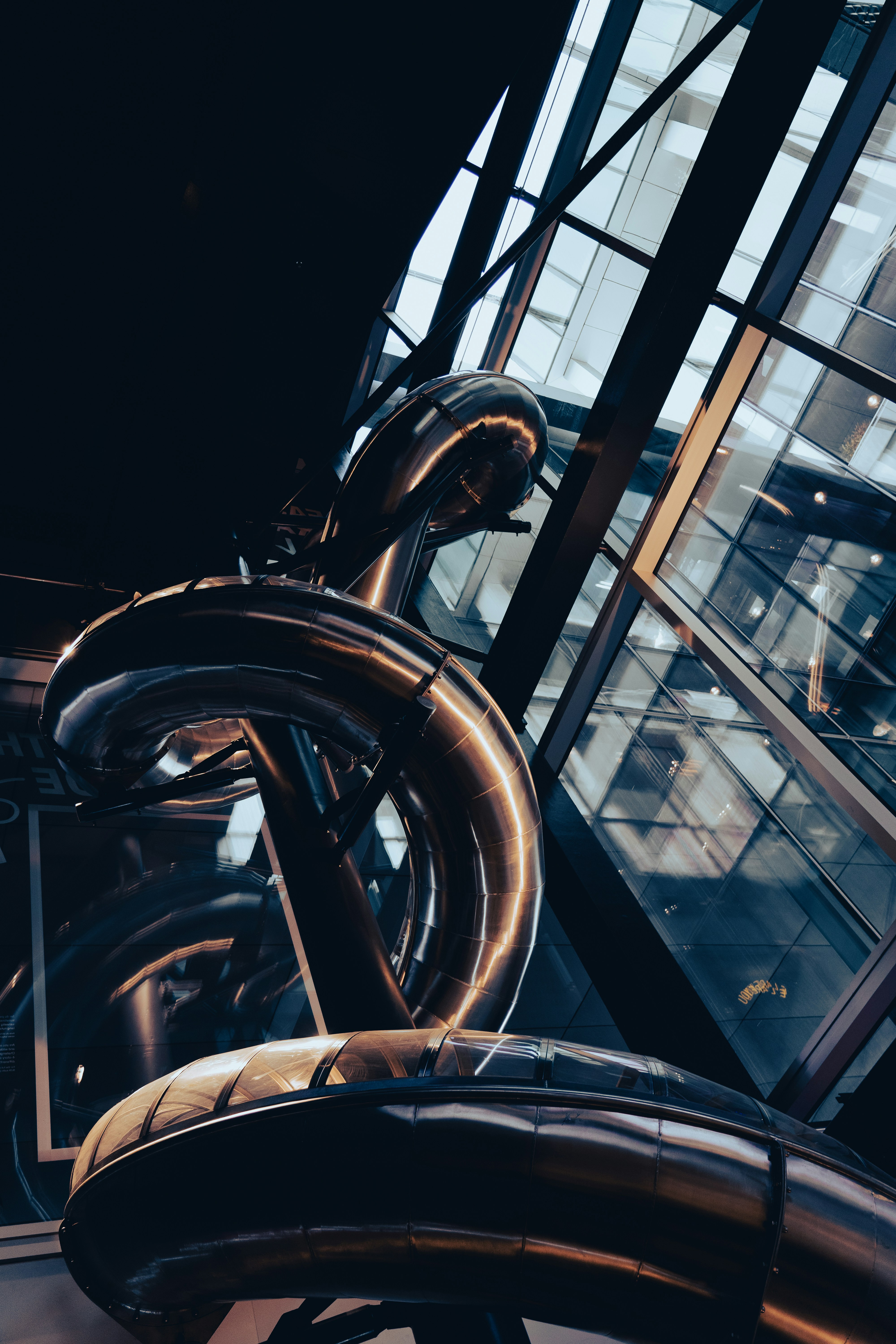 a large metal sculpture in front of a window