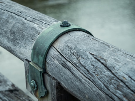 Close-up image of a fourway brace attachment securing structural beams.