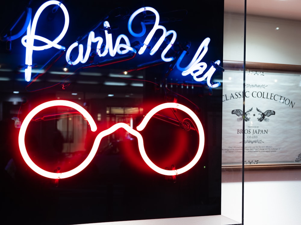 a neon sign in a window of a store