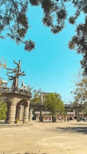 a statue in the middle of a park