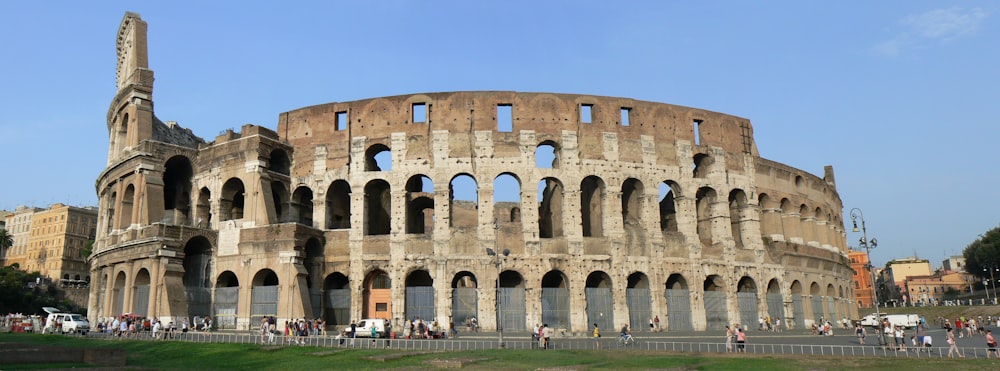 a large building with Colosseum in the background