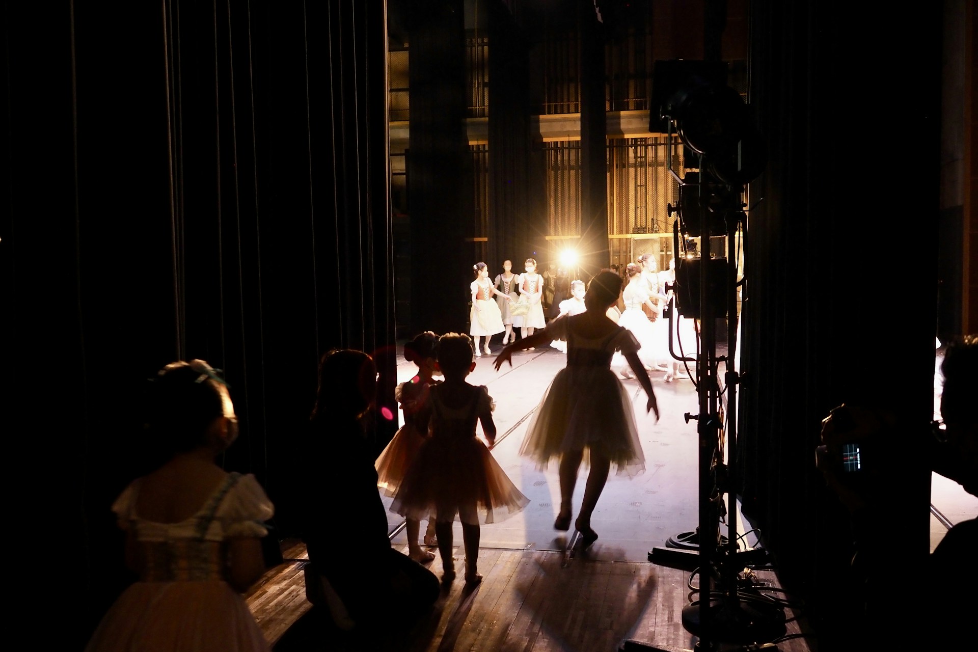 woman wearing yellow long-sleeved dress under white clouds and blue sky during daytime