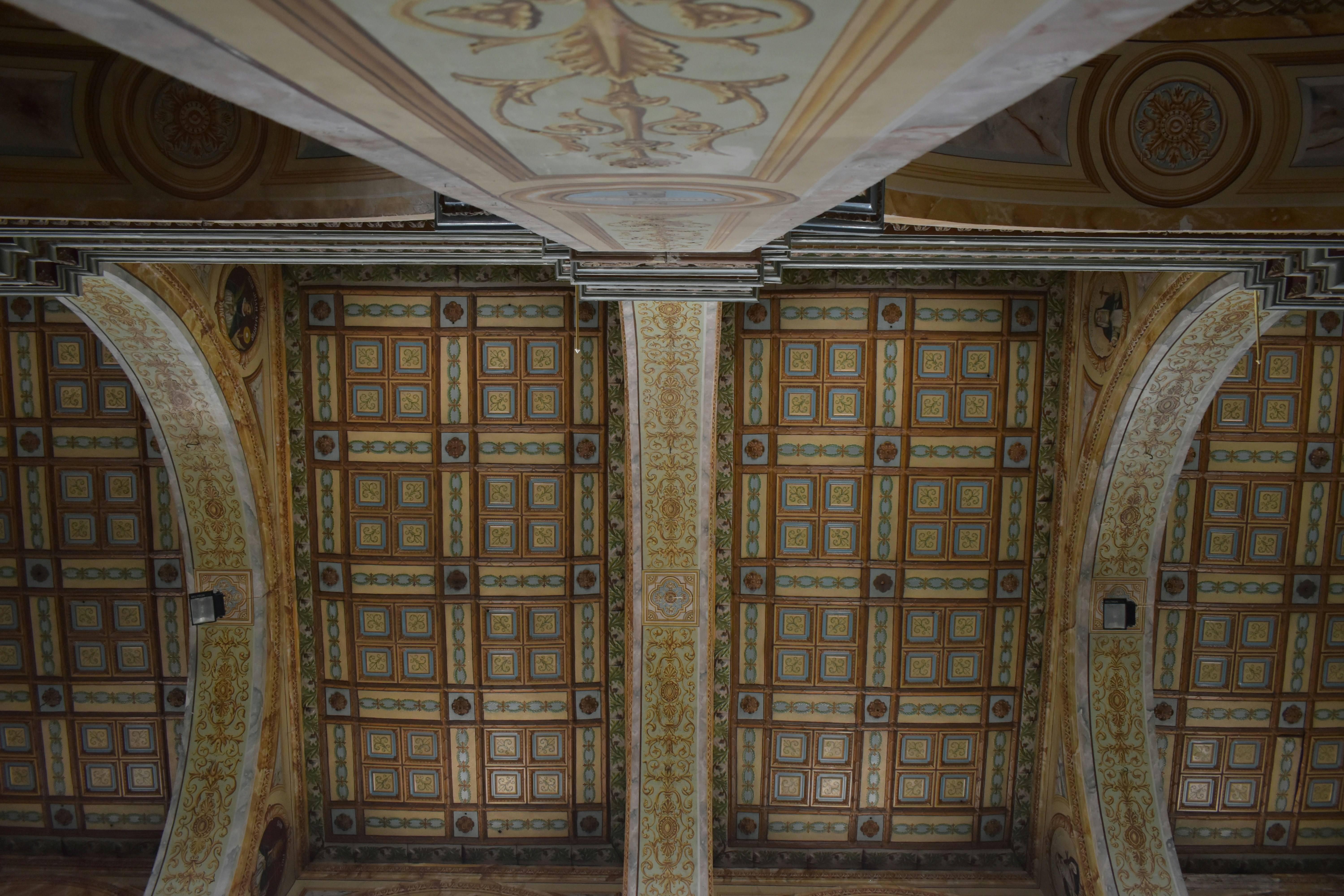 the ceiling of a building with decorative designs on it
