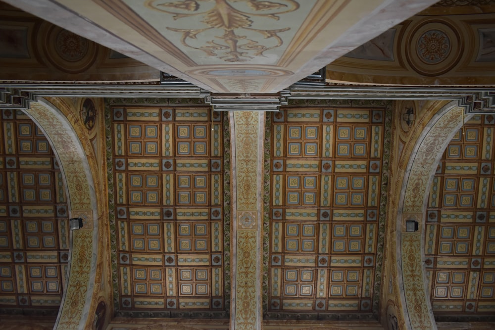 the ceiling of a building with decorative designs on it
