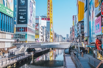 a river running through a city next to tall buildings