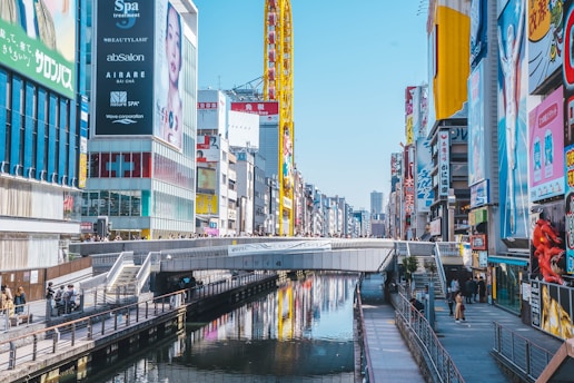 a river running through a city next to tall buildings