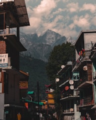 a city street with mountains in the background