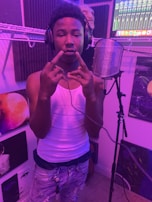 Artist in a cozy studio setting, mixing tracks with Dream Fit Monitor headphones on.