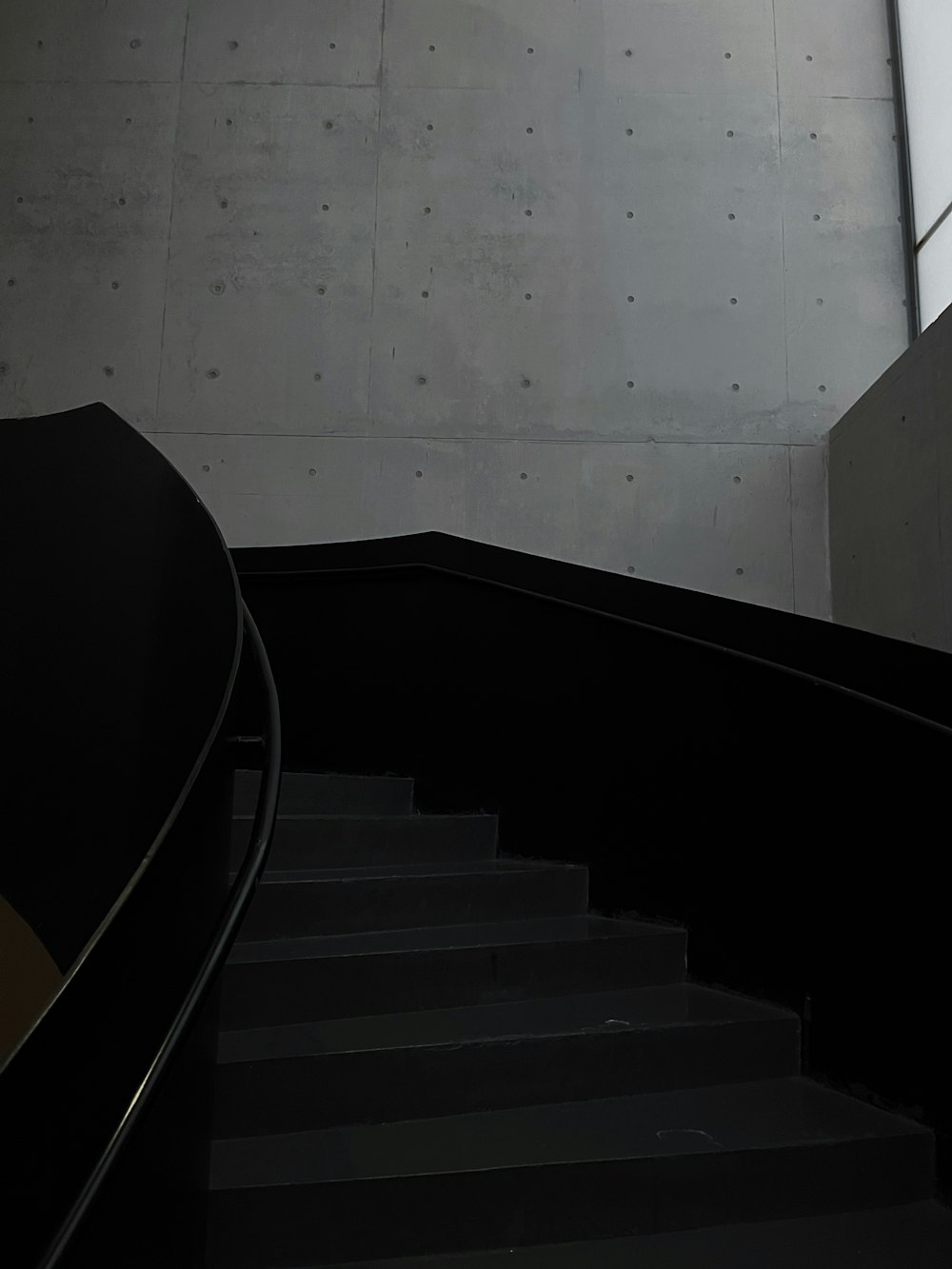 a man riding a skateboard down a flight of stairs