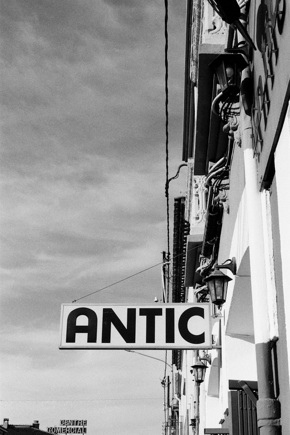 a black and white photo of a street sign