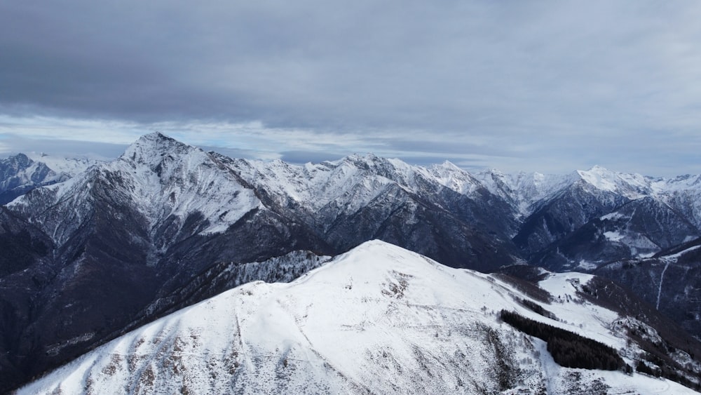 a view of a mountain range covered in snow